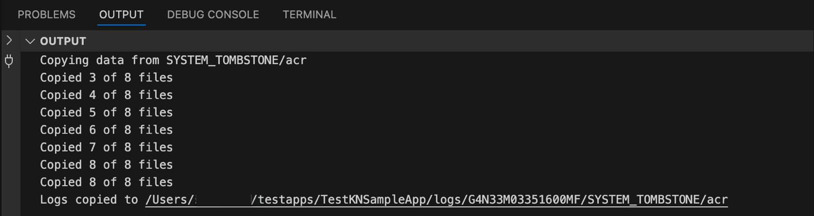 Screenshot of VS Code Output panel showing completion status and file paths for copied device logs